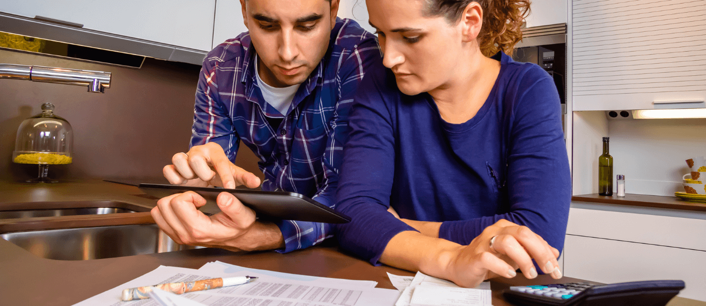 A couple looking at papers to increase their tax reduction