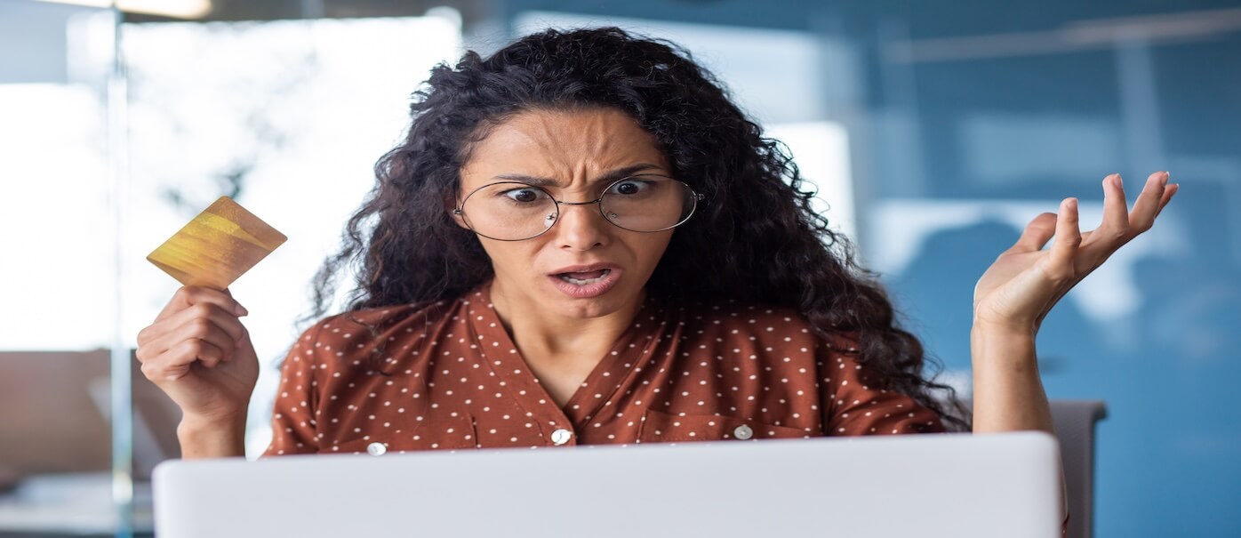 worried woman reacting to a suspected scam