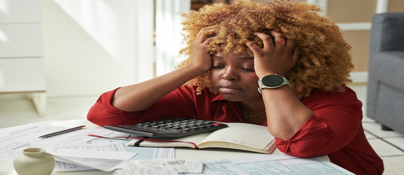 frustrated woman reviewing tax documents