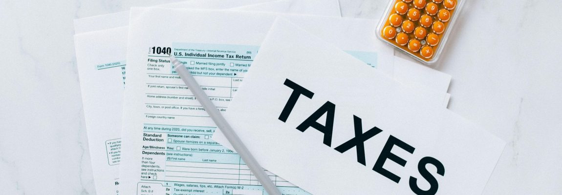 Tax papers and calculator on desk